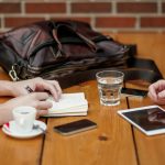 two person sitting in front of table